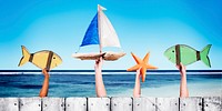 Beach and Wooden Plank Fence Hands Holding Toys Concept
