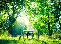 Businessman working with the nature.