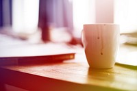 cup on the working table for coffee break