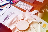 Fashion design messy workspace on wooden table