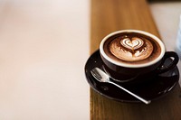 Coffee foam froth art on wooden table