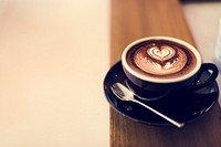 Coffee foam froth art on wooden table