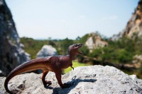 Tyrannosaurus rex jurassic figure toy on the mountain