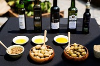Oils, nuts and olives on a table
