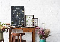 Workspace of Florist with Dry Flowers Name List on Black Board