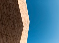 Blue sky with bricks wall building