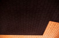 Brown orange bricks wall with light and shadow