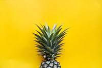 Pineapple with yellow background