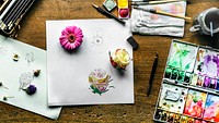 Aerial of artist table with sketch a flower