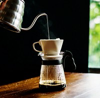 Barista hand dripping brewed coffee
