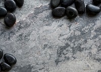 Stones on the grunge concrete background