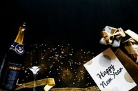 New year celebration with champagne and card