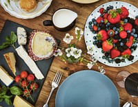 Aerial view of appetizer with cheeses and berries