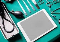 Tablet with medical tools on the table