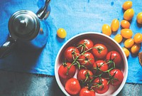 Different kinds of tomatos and metal pot