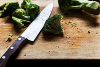 Chopped green broccoli on a wooden cutting board