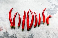 Aerial view of cayenne chili peppers on grunge background