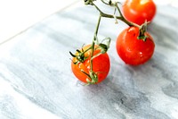 Fresh tomatoes on a marble background