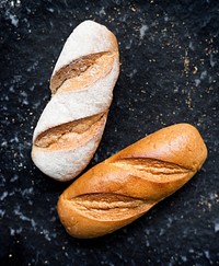 Two baguettes with black background