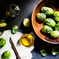 Aerial view of brussle sprouts with knife and cooking oil