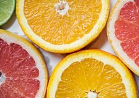 Closeup of fresh citrus fruit slices background
