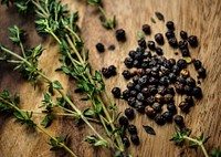 Fresh thymes and dried black peppercorns herb