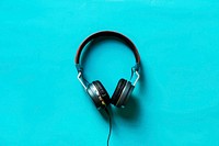 Flat lay of headphones on blue background