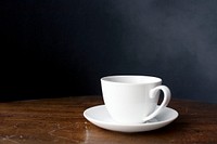 Closeup of coffee cup on wooden table