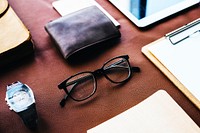 Men items on brown leather background