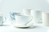 Closeup of coffee cups on white table