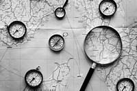Compass and magnifier on a map