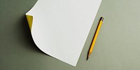 Blank paper and pencil isolated on background