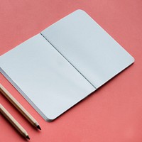 Blank notebook and pencil isolated on background