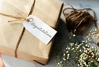 Rustic gift with congratulatory tag.
