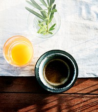 Fresh Orange Juice and Coffee with White Cloth
