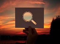 Searching discovery perforated paper magnifying glass
