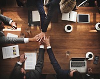 Aerial view of business people's hands piled together