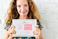 Caucasian woman holding digital tablet