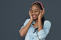 Young black girl listening to music headphones