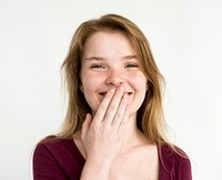 Young girl shy giggle covering mouth portrait