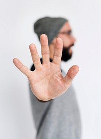 Guy doing the stop hand signal gesture