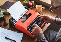 Senior typing on a typewriter