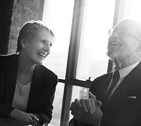 Closeup of caucasian business people smiling at meeting