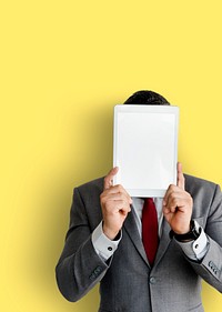 Businessman holding digital tablet covered his face