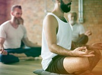 Men meditating gesture in a yoga class