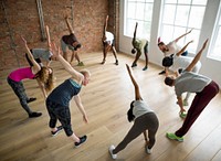Diverse group of people excercising in a circle