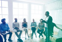 Student sitting in a class and teacher is teaching