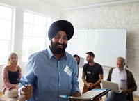 Indian man presenting in a community group
