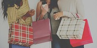Diverse women friends with shopping bags