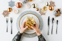 Hands holding gift on christmas holiday celebration